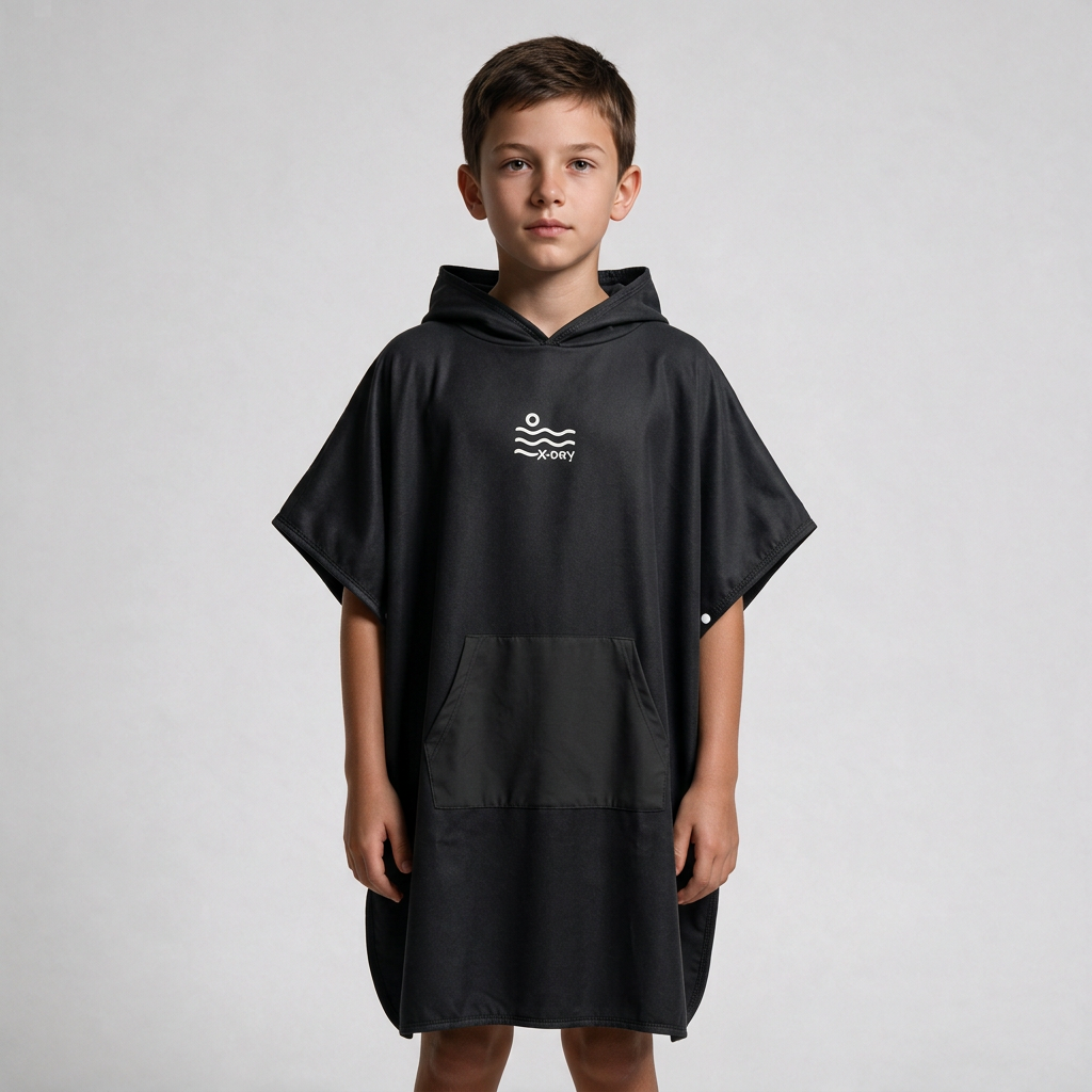 All-black poncho on boy