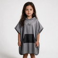 Gray poncho on dark-haired girl