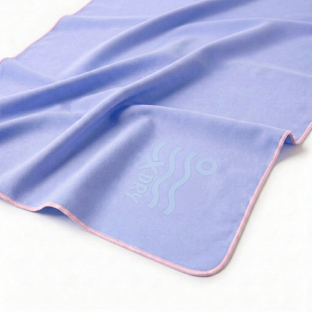 Lavender-blue towel close-up with light-pink stitching