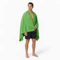 Model wearing grass-green towel