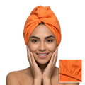 Orange hair towel on a smiling model, without any text